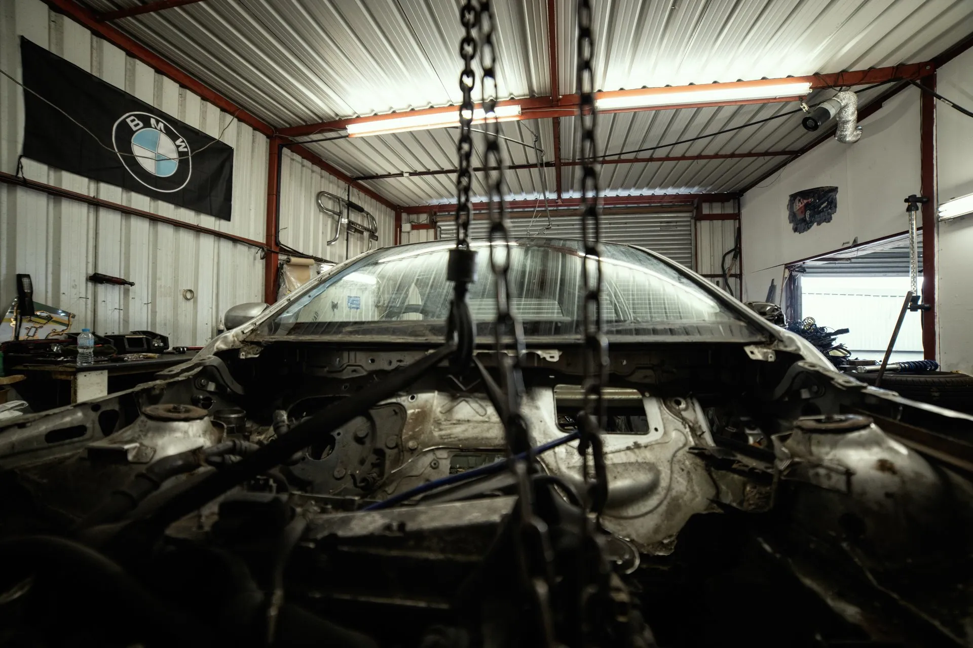 BMW workshop bay with vehicle in progress