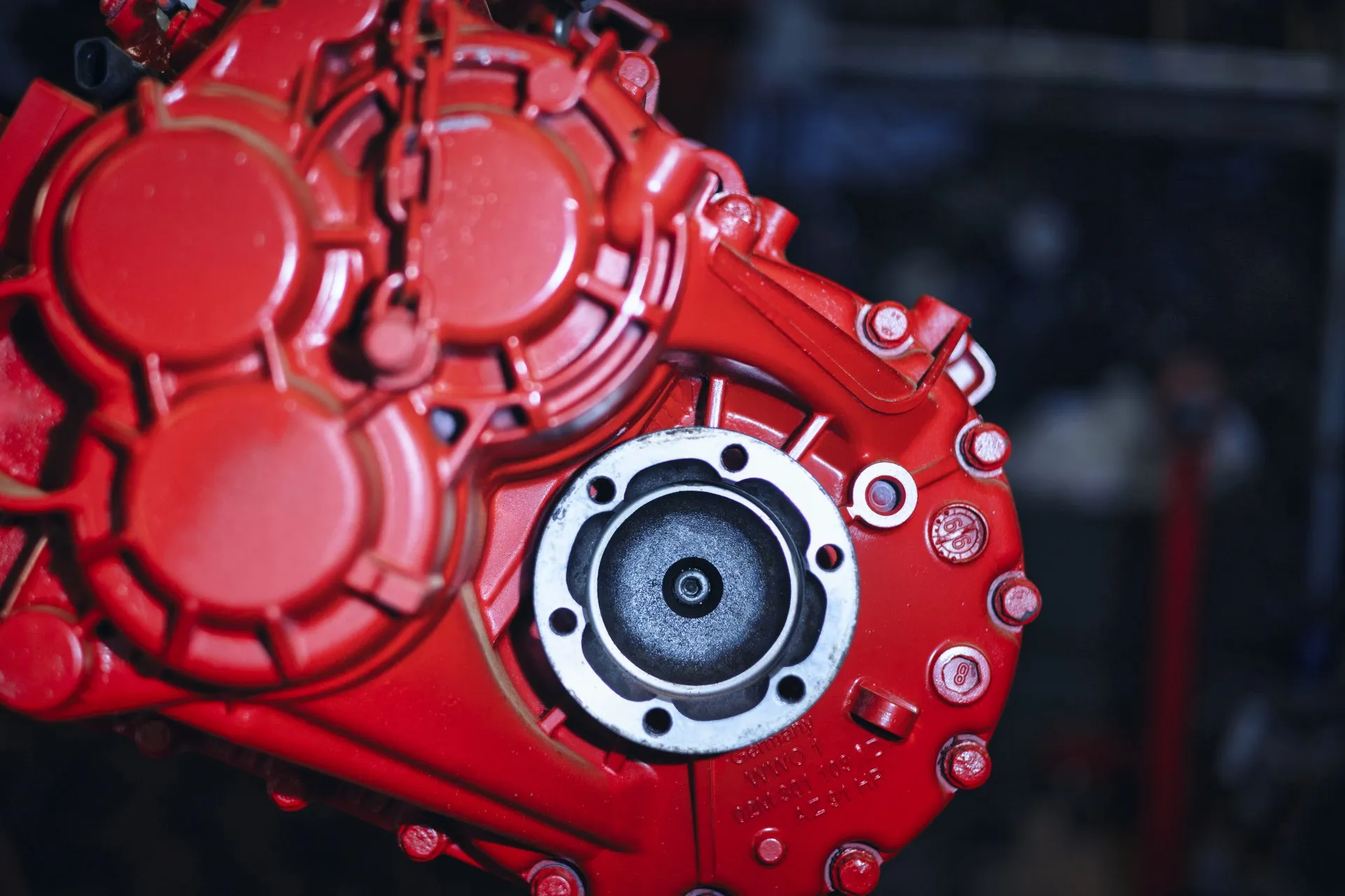 Close-up of freshly painted red gearbox housing