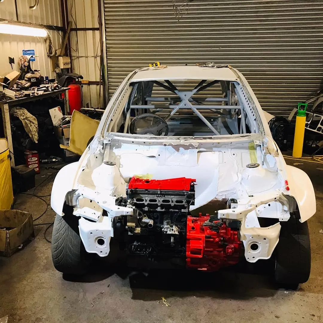 Corsa race build with red powertrain fitted between front rails